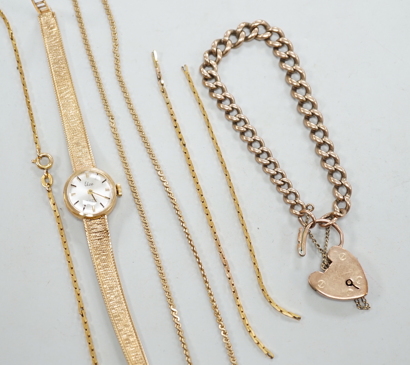 A 9c graduated curb link bracelet, a 9ct chain, a damaged 9k bracelet and a lady's 9ct gold wrist watch, gross weight 47.8 grams.